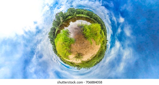 Planet Earth. Little Planet With Bank Of The River, Forest And Blue Sky.