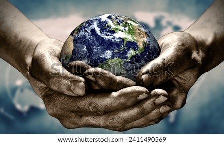 planet earth on hands with a world map background for the international safer internet day
