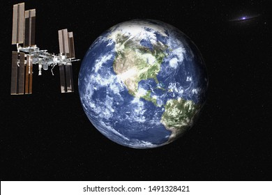 Planet Earth With Satelite Space Station Of Solar System In The Space With Far Galaxy On The Background. Blue Planet.  Science Fiction. Elements Of This Image Were Furnished By NASA