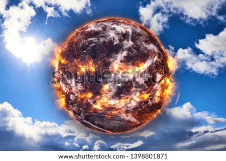 Planet Earth of Solar system explosion in the blue sky. Armageddon. Planetary death concept. Elements of this image were furnished by NASA.