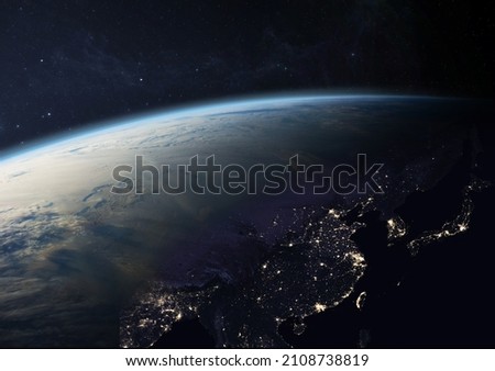 Planet Earth from the space at night. Asia at night with city lights in China, Taiwan, India, Japan, Thailand, South Korea, Vietnam and other countries. Elements of this image furnished by NASA.
