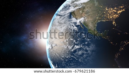 planet earth with sunrise in the space - USA - elements of this image furnished by NASA