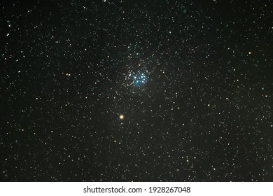 Planet Mars in the Pleiades star cluster in the night sky.