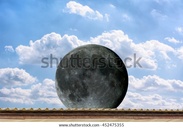 Planet Moon on the roof, on the blue sky. Elements\
of the furnished by\
NASA.