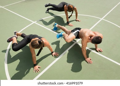 Plank Obliques Exercise, Fitness Team Promoting Insanity Workout