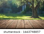 Plank wooden board with nature background.