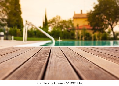 the planking of a swimming pool with shallow depth of field