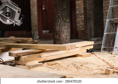 Planks of Wood Surrounded by Saw Dust at Construction Site of New Home