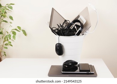 Planned Obsolescence, E-waste, Electronics Waste For Reuse And Recycle Concept. Recycling Bin Full Of Old Electronic Devices