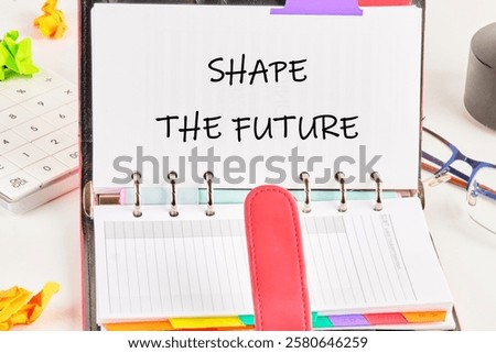 A planner displays the text 'SHAPE THE FUTURE' emphasizing the importance of strategic planning in education and business development.