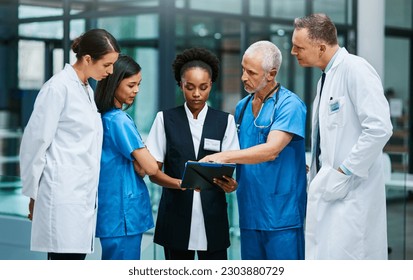 Planning, clipboard and medical with doctors in hospital for consulting, teamwork and communication. Medicine, healthcare and checklist with group of people for support, review and analysis - Powered by Shutterstock