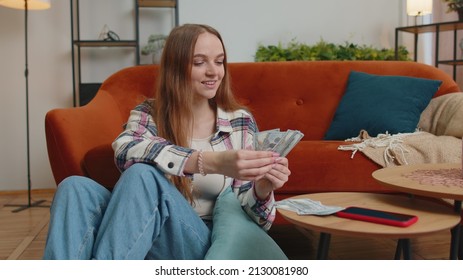 Planning Family Budget. Smiling Happy Young Woman Counting Money Cash, Calculate Domestic Bills At Home. Joyful Girl Satisfied Of Income And Saves Money For A Planned Vacation, Gifts, Future Expenses