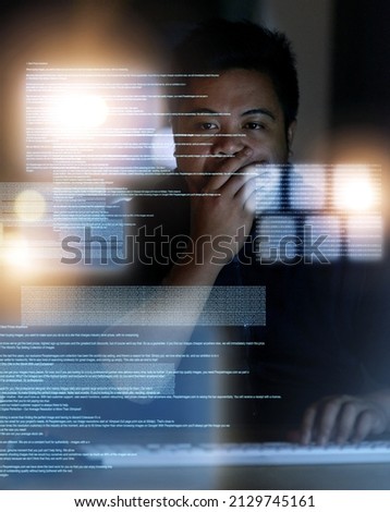 Planning his next move. Shot of a hacker cracking a computer code in the dark.
