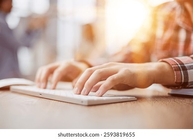 planning his work process, taking notes and using laptop. cropped image