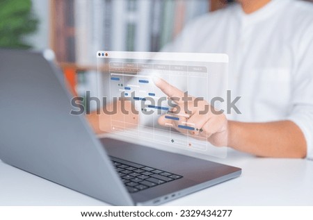 Planning and Implementation concept, Businessman uses laptop computer to manage work projects and update progress tasks. Increase work efficiency by Gantt chart schedules. Operation proceeding update.