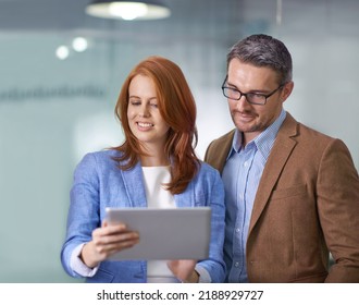 Planning, innovation and talking about ideas on a tablet while creative businesspeople check their growth on a mobile app. Teamwork, collaboration and thinking while sharing vision and mission - Shutterstock ID 2188929727