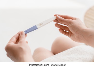 Planning Parenting. Future Mother. Woman Holding Negative Positive Pregnancy Test. Adoption, Abortion Invitro Fertilization Concept