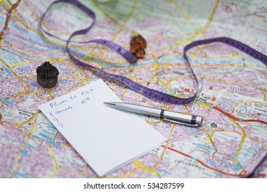 Planning route of city visiting. Big map on table with equipment - Shutterstock ID 534287599