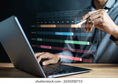 Planning workflow process concept. Flowchart solution implementation. Strategy diagram plan management. Planning business. A man is using a laptop with a screen displaying a graph with a line.