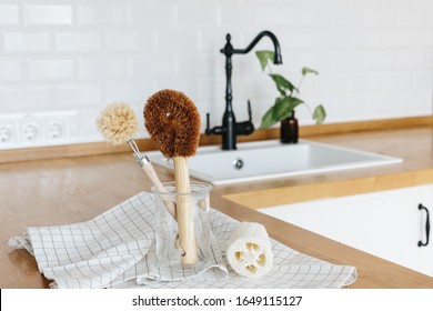 Plant Based Cleaning Brush Set Kitchen White Kitchen Background. Eco Friendly Kitchen, Zero Waste Home Concept