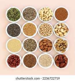 Plant based health food high in lipds. Ingredients contain unsaturated fats for healthy heart and cholesterol levels with nuts, seeds, legumes and grain. On neutral background. - Powered by Shutterstock