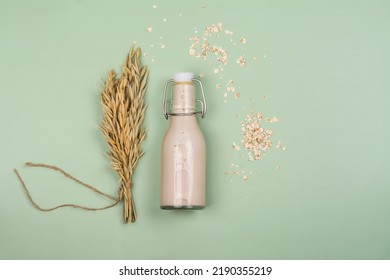 Plant Based, Lactose Free Milk. Homemade Oat Milk With Ingredients On Wooden Background. World Plant Milk Day. Copy Space