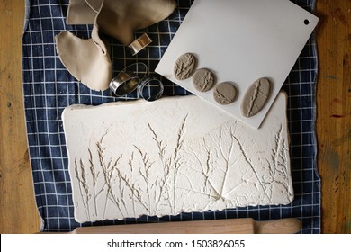 Plant Gypsum Sample And Clay Molds Made From It, Raw Clay Jewelry Samples In A Pottery Workshop Before Firing, Tools And Work Flow In A Pottery Workshop, Plant Imprinted Clay