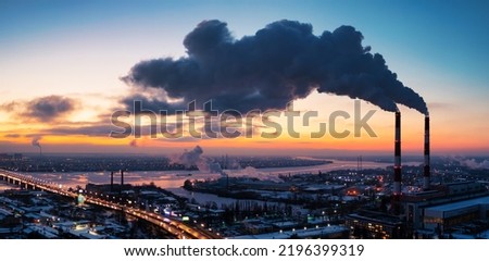 Plant pipe high above the clouds. Harmful emissions into the upper atmosphere. Climate change due to the combustion of carbon fuel.