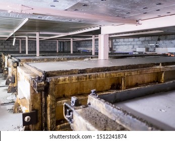 Plant for production of aerated concrete building blocks according to German technology.Equipment supplied by German company. Pipe, mixing drums, drying chambers, conveyors for moving - Shutterstock ID 1512241874