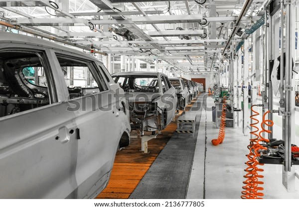 Plant for production of cars. Modern\
automotive industry. Electric car factory,\
conveyor