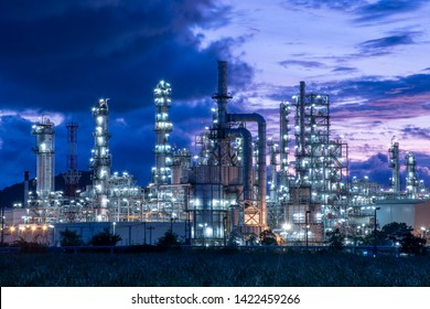 Oil​ refinery​ and​ petrochemical​ plant industrial,natural​ gas​ storage​ tank, pipe​line​ steel​ at​ blue​ cloud​ sky​ background​ - Powered by Shutterstock