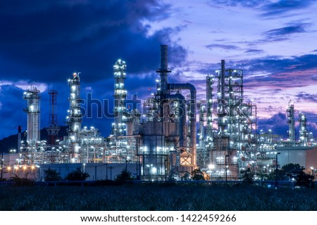 Oil​ refinery​ and​ petrochemical​ plant industrial,natural​ gas​ storage​ tank, pipe​line​ steel​ at​ blue​ cloud​ sky​ background​