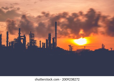 Oil​ refinery​ and​  plant and tower column of Petrochemistry industry in pipeline oil​ and​ gas​ ​industrial with​ cloud​ slowing red sky the morning background​