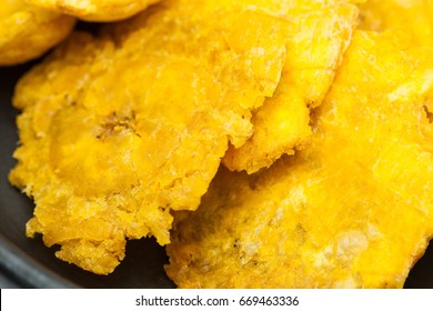 Plantain Patacones On Black Ceramic Dish