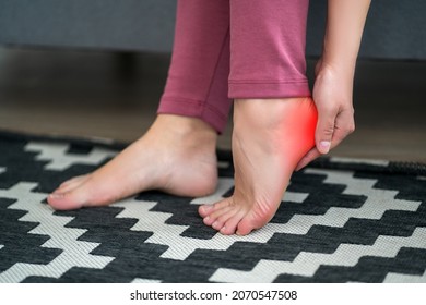 Plantar fasciitis, heel spur, foot pain, man suffering from feet ache at home, podiatry concept
