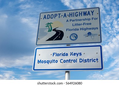 PLANTATION KEY, FLORIDA/USA - DECEMBER 2016: Florida Keys Mosquito Control District Highway Sign Zika Virus Reduction Program