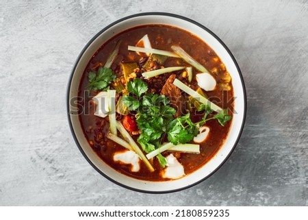 plant-based Mexican vegetable stew with beans mock meat celeri and coriander in spicy sauce, healthy vegan food recipes