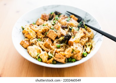 Plant-based Noodles Stir Fry With Broccoli Peas And Marinated Tofu Chunks, Healthy Vegan Food Recipes