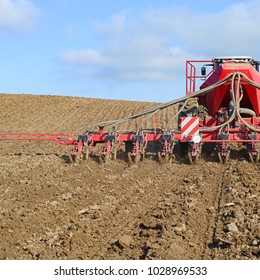 Planting Corn Trailed Planter In The Field 