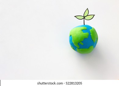 Planting Tree In Green Globe , Environment Conservation ,CSR Abbreviation Or Corporate Social Responsibility