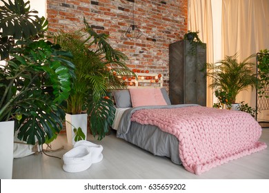 Plants In Modern Bedroom With Brick Wall And Bed