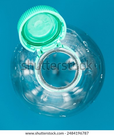 Plasic bottle with attached cap
