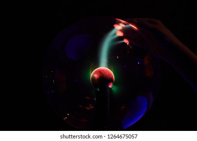 Plasma Ball Lamp Energy, Child Boy Hand Touching Glowing Glass Sphere, Concept For Power, Electricity, Science And Physics