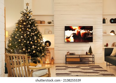 Plasma TV On White Wooden Wall In Living Room Beautifully Decorated For Christmas