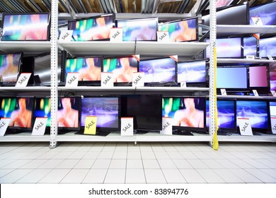 Plasma TVs With Big Diagonal Stand On Shelves In Large Shop; Wide Range
