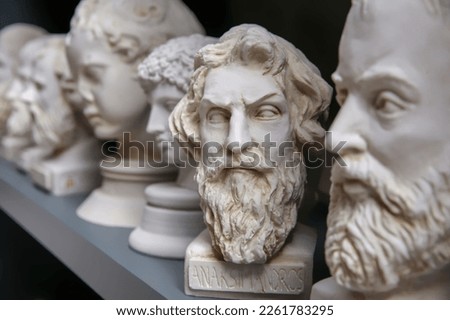 Plaster bust of philosopher Anaximander and group of other busts. Portraits of ancient historical persons. Mass-product souvenir in Turkey. Copy space, selected focus