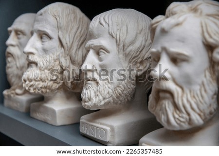 Plaster bust of philosopher Aristoteles and group of other busts. Portraits of ancient historical persons. Mass-product souvenir in Turkey. Copy space, selected focus