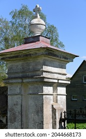 Plastered Brick Fence Post With A Cross At The Top