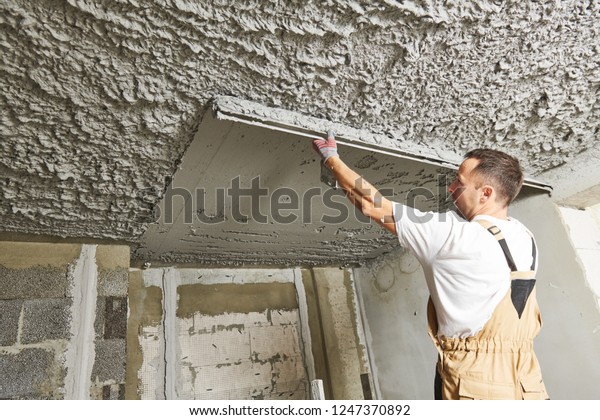 Plasterer Smoothing Plaster Mortar On Ceiling Stock Photo Edit