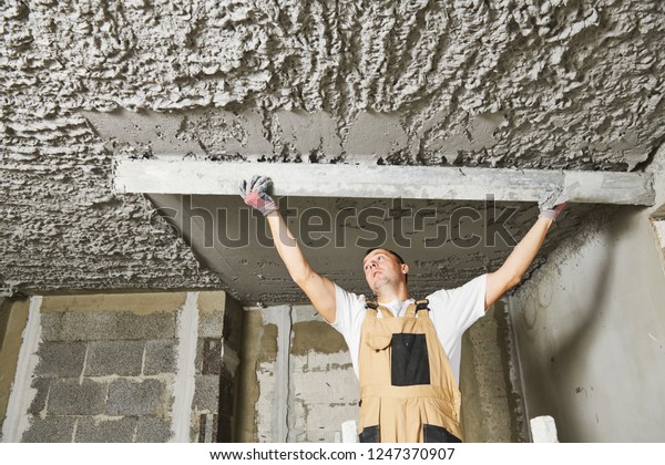 Plasterer Smoothing Plaster Mortar On Ceiling Stock Photo Edit